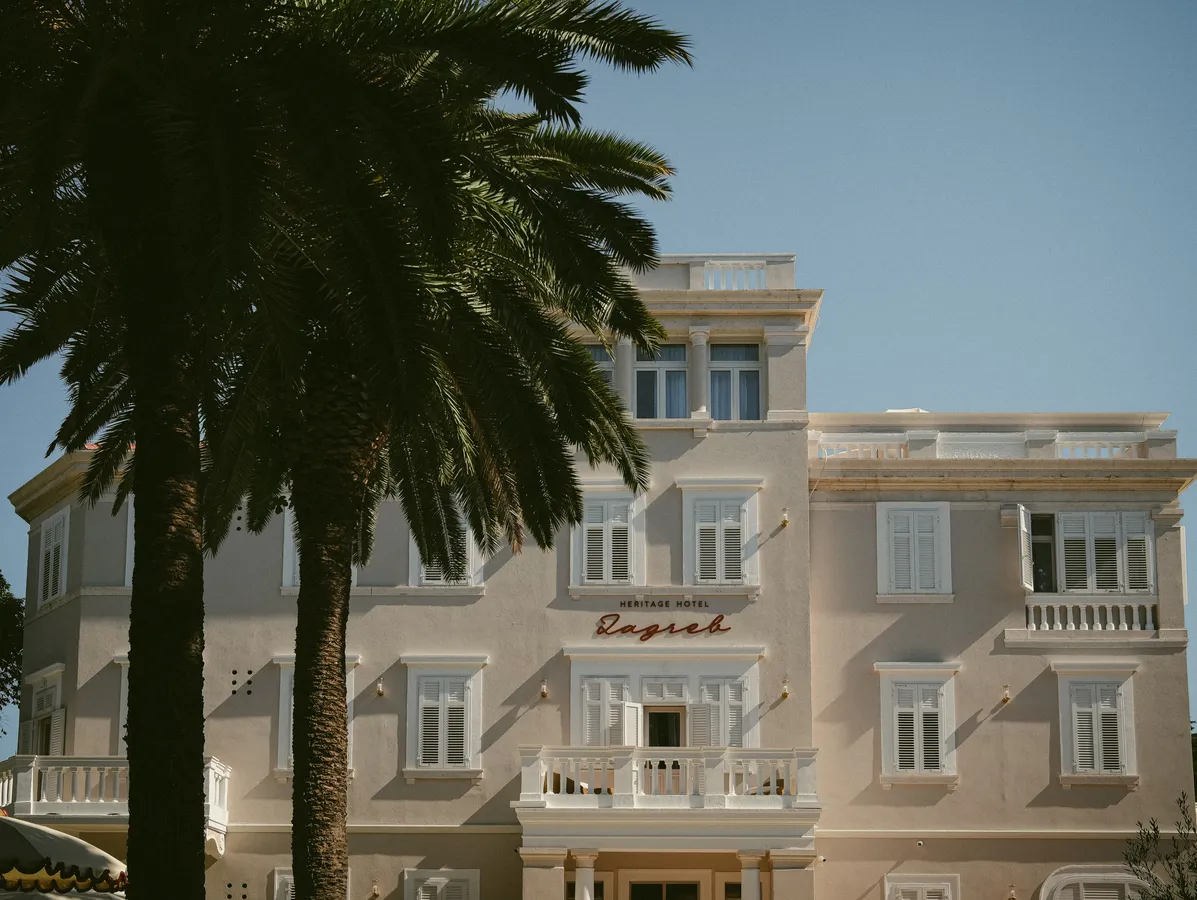 Hotel Zagreb façade behind the garden palms