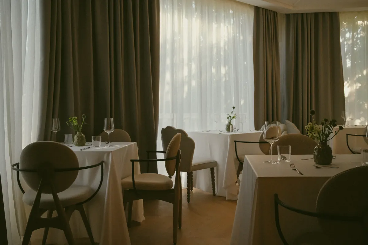 Restaurant dining room set for dinner